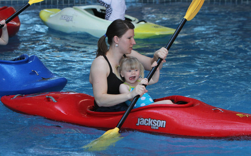 Francisco Kjolseth  |  The Salt Lake Tribune
Jen Crosby, of Portland, Ore., paddles around with her daughter Alayna, 2, for a free kayak clinic as part of the annual Bryce Canyon Winter Festival Feb. 16-18 at Ruby's Inn in Bryce Canyon City. Crosby has been attending the festival for the past 26 years.