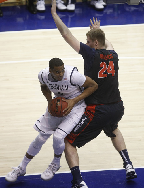 Chris Detrick  |  The Salt Lake Tribune
Brigham Young Cougars forward Brandon Davies (0) shoots around Gonzaga Bulldogs center Przemek Karnowski (24) during the first half of the game at the Marriott Center Thursday February 28, 2013. Gonzaga is winning the game 35-31 at halftime.