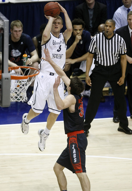 Chris Detrick  |  The Salt Lake Tribune
Brigham Young Cougars guard Tyler Haws (3) shoots over Gonzaga Bulldogs guard Mike Hart (30) during the first half of the game at the Marriott Center Thursday February 28, 2013. Gonzaga is winning the game 35-31 at halftime.
