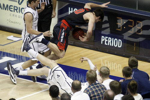 Chris Detrick  |  The Salt Lake Tribune
Gonzaga Bulldogs guard Mike Hart (30) and Brigham Young Cougars forward Nate Austin (33) fall out of bounds during the first half of the game at the Marriott Center Thursday February 28, 2013. Gonzaga is winning the game 35-31 at halftime.