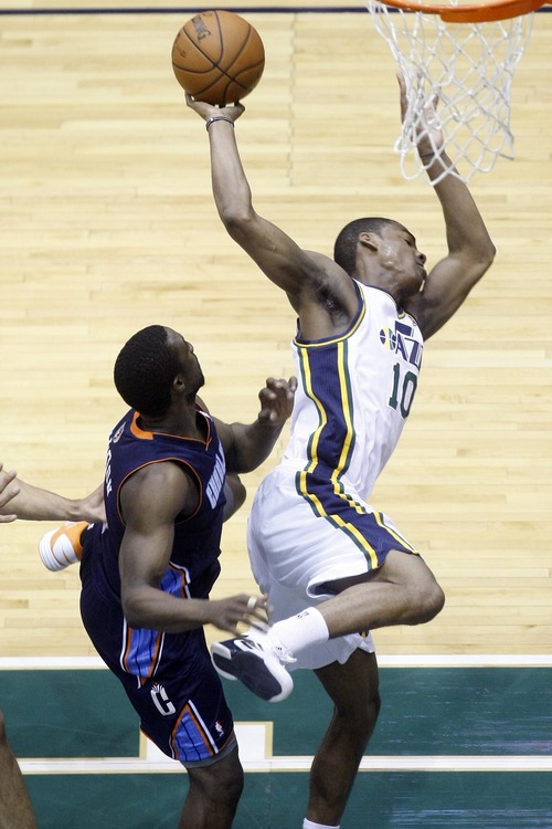 Chris Detrick  |  The Salt Lake Tribune
Utah Jazz point guard Alec Burks (10) is fouled by Charlotte Bobcats shooting guard Ben Gordon (8) during the first half of the game at EnergySolutions Arena Friday March 1, 2013.