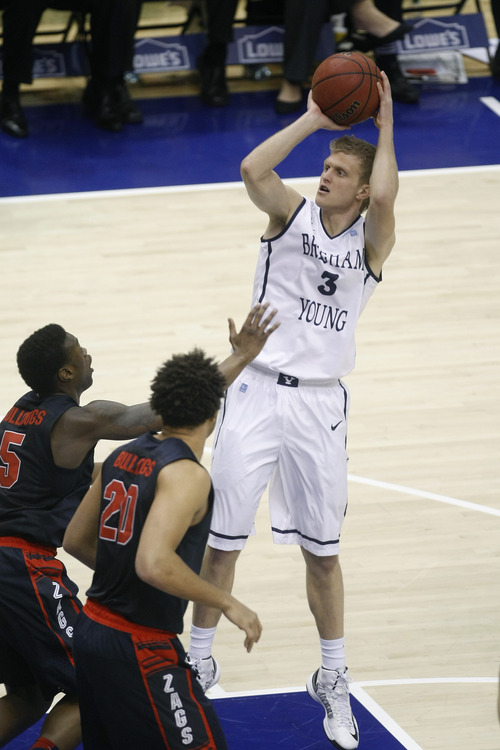 Chris Detrick  |  The Salt Lake Tribune
Brigham Young Cougars guard Tyler Haws (3) shoots over Gonzaga Bulldogs guard Gary Bell, Jr. (5) and Gonzaga Bulldogs forward Elias Harris (20) during the first half of the game at the Marriott Center Thursday February 28, 2013. Gonzaga is winning the game 35-31 at halftime.