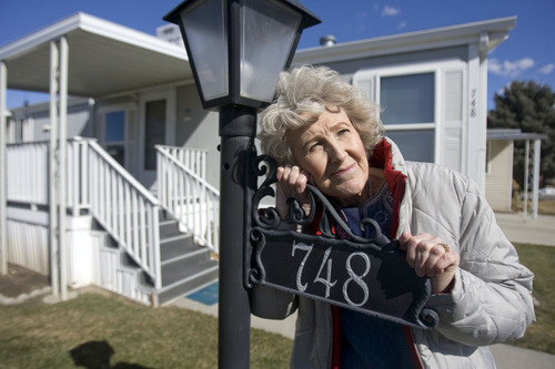 Kim Raff  |  The Salt Lake Tribune
Gloria Feil stands outside of the mobile home she owns with her husband, Daniel, at the Monte Vista Mobile Home Park in Salt Lake City on March 4, 2013. HB143 is a mobile-home bill that tries to balance the competing property rights of mobile-home owners and park land owners. Shellie McHaley, manager of the park, spoke out against the bill.