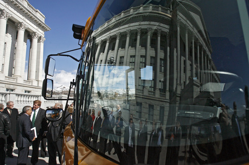 Francisco Kjolseth  |  The Salt Lake Tribune
Crowds gather as they await the arrival of Gov. Gary R. Herbert before packing himself, legislators and the press into a CNG school bus parked next to the Capitol on Monday, March 4, 2013 for an announcement. The governor re-affirmed his call for state and local government, schools, public transit, businesses and industry to transition more of their fleet to clean fuel vehicles, as bill SB275 initiates a process to target heavy vehicle and fleet emissions.