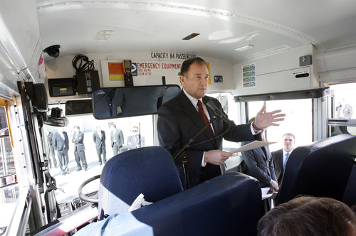 Francisco Kjolseth  |  The Salt Lake Tribune
Governor Gary R. Herbert packs himself, legislators and the press into a CNG school bus parked next to the capitol on Monday, March 4, 2013 for an announcement. The governor re-affirmed his call for state and local government, schools, public transit, businesses and industry to transition more of their fleet to clean fuel vehicles, as bill SB275 initiates a process to target heavy vehicle and fleet emissions.