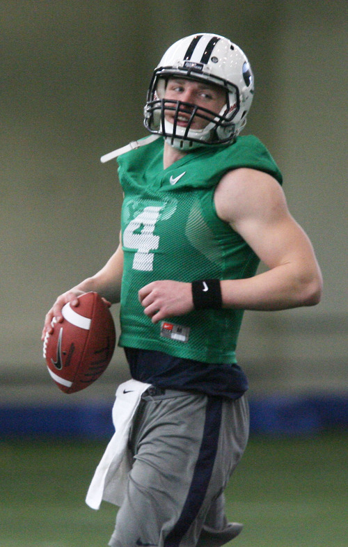 Steve Griffin | The Salt Lake Tribune

BYU quarterback, Taysom Hill,  runs with the football during spring practice at the indoor practice facility at BYU in Provo, Utah Monday March 4, 2013.