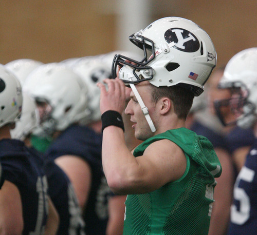 Steve Griffin | The Salt Lake Tribune

BYU quarterback, Taysom Hill,  takes a break during spring practice at the indoor practice facility at BYU in Provo, Utah Monday March 4, 2013.