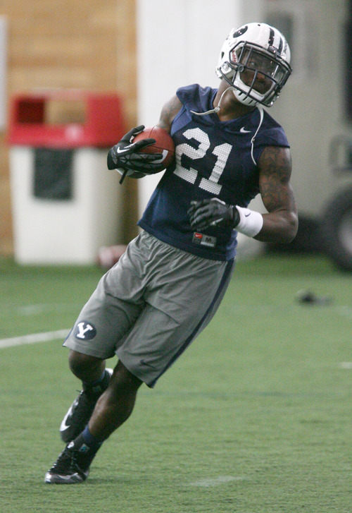 Steve Griffin | The Salt Lake Tribune

BYU running back, Jamaal Williams, runs with the ball during spring practice at the indoor practice facility at BYU in Provo, Utah Monday March 4, 2013.