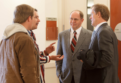 Trent Nelson  |  The Salt Lake Tribune
Attorney Jeffrey Shields, right, and Jethro Barlow, center, listen to Merrill Stubbs following a hearing on the UEP land trust Tuesday in Salt Lake City. Patrick Pipkin at left.