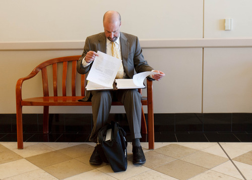 Trent Nelson  |  The Salt Lake Tribune
Assistant Attorney General David Wolf looks over documents prior to a hearing on the UEP land trust Tuesday {month name} 5, 2013 in Salt Lake City