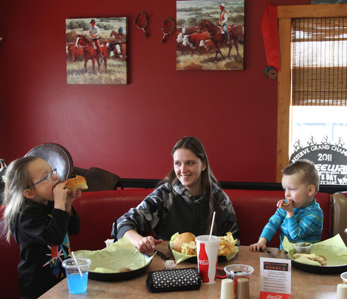 Rick Egan  | The Salt Lake Tribune 
Mieke Smith, 5 (left), and Jaden Smith, 2, (right) have lunch with their mom, Shelby Smith, at Richard's Round Up Barbecue on Main Street in Grantsville, Thursday, Feb. 28, 2013.