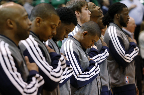 Chris Detrick  |  The Salt Lake Tribune
Members of the Utah Jazz team listen during the National Anthem before the game at EnergySolutions Arena Friday March 1, 2013.