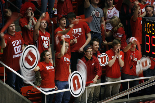 Scott Sommerdorf   |  The Salt Lake Tribune
Ute fans twirl the "drum and feather" logo during a time out as the Arizona Wildcats beat Utah 68-64 in Salt Lake City, Sunday, Feb. 15, 2013. Attendance at the game -- 11,712 -- was the season high for the Utes, which have the fourth highest attendance in the Pac-12.