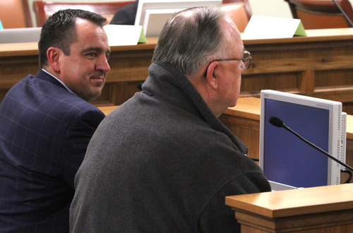 Rick Egan  | The Salt Lake Tribune 

Rep. Greg Hughes (left) listens as Frank Maughan, Chairman, Veterans Advisory Council, (right) talks about HB395 in front of the House Public Utilities and Technology Committee, Wednesday, March 6, 2013.