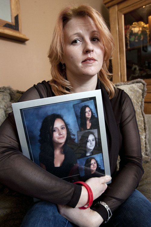 Steve Griffin | The Salt Lake Tribune

Veronica Kasprzak holds a photograph of her daughter, Anne Kasprzak, in the living room of her South Jordan, Utah home Wednesday March 6, 2013. Draper police announced that a man they arrested a year ago, for the murder Anne Kasprzak, is no longer a suspect.