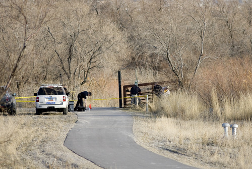 Kim Raff | The Salt Lake Tribune 
Police investigate the crime scene near the Jordan River and 12300 South in Draper where Anne Kasprzak's body was found on March 11, 2012.