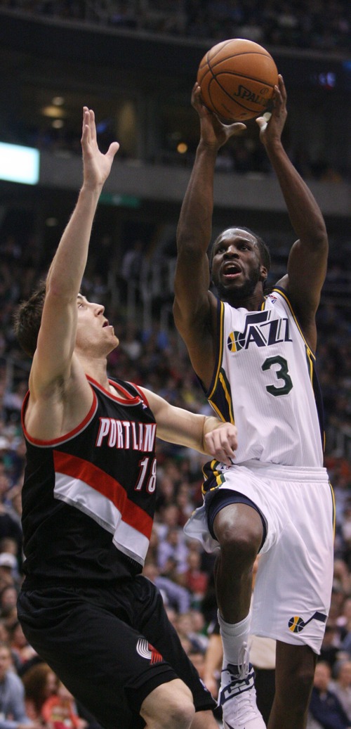 Kim Raff  |  The Salt Lake Tribune
(left) Portland Trail Blazers small forward Victor Claver (18) defends as Utah Jazz small forward DeMarre Carroll (3) drives the basket during the second half at EnergySolutions Arena in Salt Lake City on February 1, 2013.  The Jazz went on to win the game 86-77.