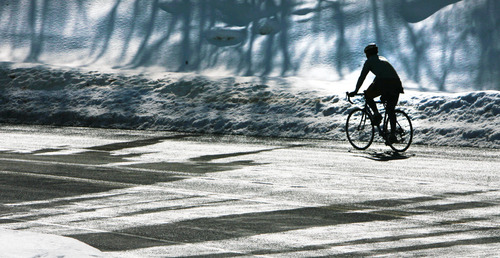 Steve Griffin | The Salt Lake Tribune
A bike rider pedals up Emigration Canyon as water from melting snow runs across the road in Salt Lake City on March 1, 2013.