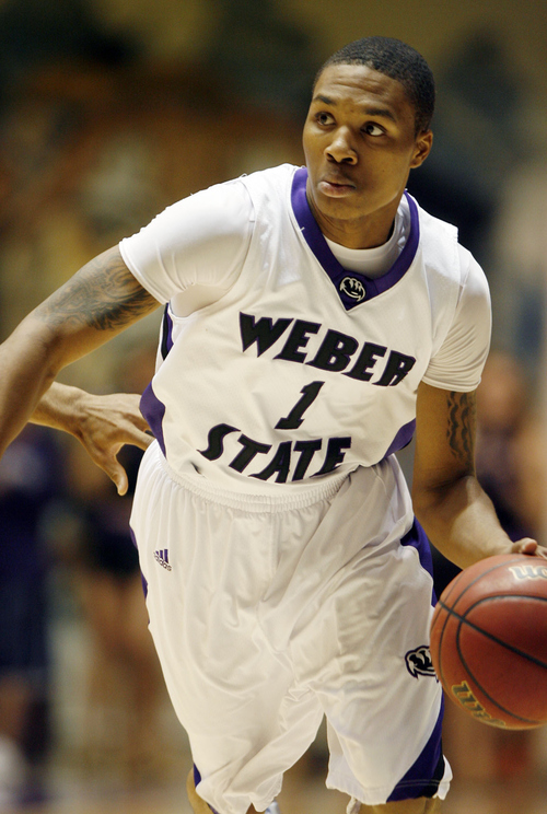 Steve Griffin  |  The Salt Lake Tribune

Ogden -  Weber State's Damian Lillard jumps drives the ball to the basket late in the second half  of the their basketball game at the Dee Events Center in Ogden Wednesday Dec 2, 2009,