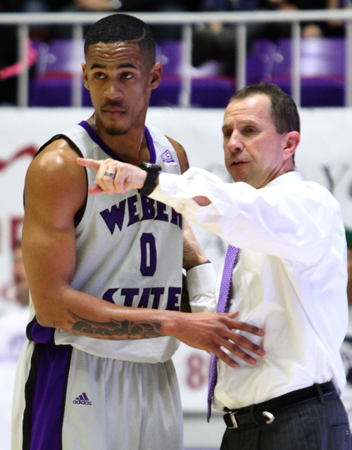 Rick Egan  | The Salt Lake Tribune 

Weber State Wildcats guard Gelaun Wheelwright (0) talks to Weber State Wildcats head coach Randy Rahe, in basketball action at the Dee Event Center in Ogden, Monday, February 11, 2013.