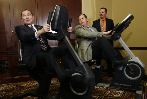 Scott Sommerdorf   |  The Salt Lake Tribune
Gov. Gary Herbert, left, speaks with Rep. Eric Hutchings, R-Kearns, center, and Rep. Paul Ray, R-Clearfield, right, while he and Hutchings pedal on stationary bikes to highlight the importance of exercise during the governor's availability, Thursday, March 7, 2013.