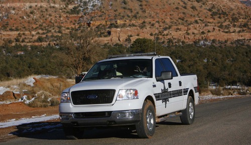 Trent Nelson  |  Tribune file photo
A Marshal with the Hildale/Colorado City Town Marshals patrol in Hildale, Utah, in Dec. 2006.