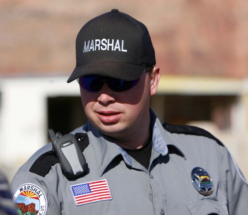 Trent Nelson  |  Tribune file photo
Preston Barlow, an FLDS member and marshal with the Hildale/Colorado City Town Marshals, in Hidale on Dec. 20, 2006.