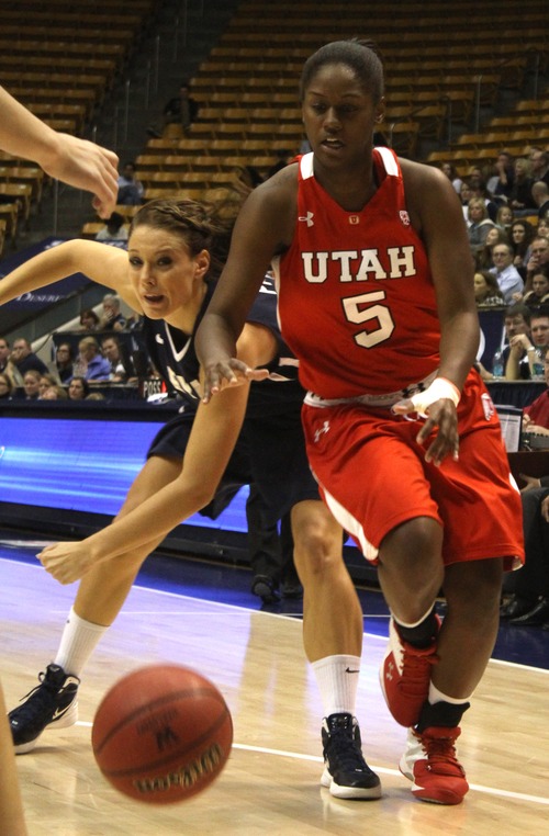 Rick Egan  | The Salt Lake Tribune 

BYU's Kim Parker (4) goes for the ball along with lady Ute, Cheyenne Wilson (5) in basketball action, BYU vs. Utah, at the Marriott Center in Provo,   Saturday, December 10, 2011.