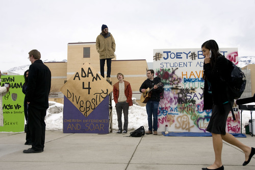 Kim Raff  |  The Salt Lake Tribune
Utah State University student (middle left) Adam Addley campaigns for student office with his friends (middle) Bert Sainabury and (right) Nikolai Croft on campus in Logan on February 25, 2013. Utah State University is stepping up recruitment of out-of-state students to make up for lower enrollment numbers after the lowering of the missionary age.
