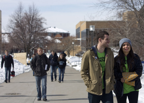 Kim Raff  |  The Salt Lake Tribune
Utah State University students (left) Kevin Meacham and Brittan Teahan walk to class on campus in Logan on February 25, 2013. Utah State University is stepping up recruitment of out-of-state students to make up for lower enrollment numbers after the lowering of the missionary age.