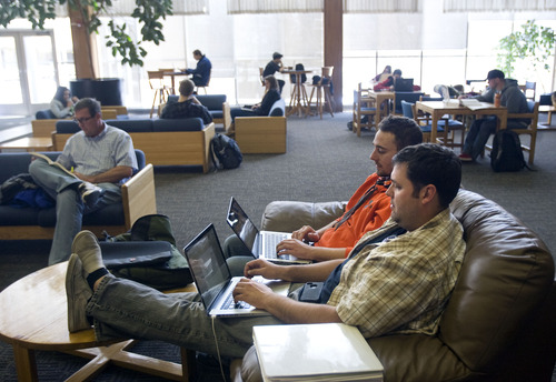 Kim Raff  |  The Salt Lake Tribune
(back middle) Tristan Prescott, a freshman from Grace, ID, and (front) Rob Castleton, a junior from Alberta, Canada, study in a lounge at the Taggart Student Center on Utah State University campus in Logan on February 25, 2013. Utah State University is stepping up recruitment of out-of-state students to make up for lower enrollment numbers after the lowering of the missionary age.