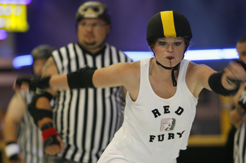 Leah Hogsten  |  The Salt Lake Tribune
A member of the Salt City Derby Girls roller derby team is seen in this 2006 file photo. On March 9, 2013, The Wasatch Roller Derby League and Camp Hobe will hold the Skater Smackdown, a match between the women's roller derby teams, Hot Wheelers and Salt Flat Fallout.