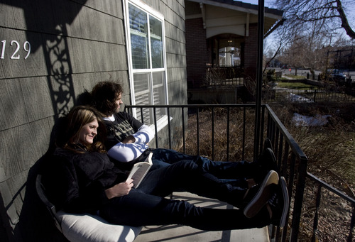 Kim Raff  |  The Salt Lake Tribune
(left) Heather and Tappan Wybrow sit in the sun on their porch on 900 East in Salt Lake City on March 9, 2013.