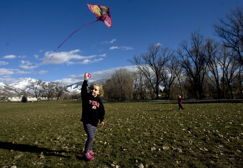 Kim Raff  |  The Salt Lake Tribune
Elizabeth Debirk flies a kite with her family in Sugarhouse Park in Salt Lake City on March 9, 2013.