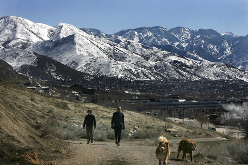 Scott Sommerdorf   |  The Salt Lake Tribune
Gina Sanzebacher, left, and Jesse McDonald hiked the trails east of the University of Utah with their dogs Elsie and Bean, as Sunday brought Spring-like weather to Salt Lake, Sunday, March 10, 2013.