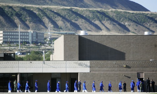 Kim Raff | The Salt Lake Tribune
Inmates at the Utah State Prison walk in the Timpanogos Gym in the Utah Department of Corrections campus to receive diplomas in a commencement exercise in Draper, Utah on June 12, 2012. The Utah State Prison and Canyons School District presented diplomas to about 340 men and women who have graduated from from the prison's high school program.
