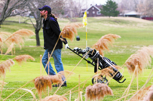 Francisco Kjolseth  |  The Salt Lake Tribune
Travis Fornelius hits the green for the first time of the season at Forest Dale golf course in Salt Lake City on Friday, March 8, 2013, as many courses open up for the season with daylight savings just around the corner.