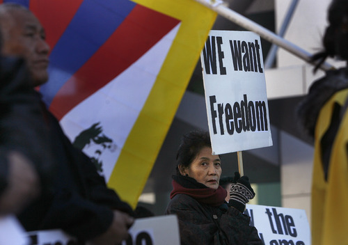 Scott Sommerdorf  |  The Salt Lake Tribune
Protester Ngodup Wangmo holds a "We Want Freedom" sign during the Tibetan community of Utah's observance of the 54th worldwide commemoration of National Tibetan Uprising Day at the Wallace Bennett Federal Building, Sunday, March 10, 2013. On this date in 1959, tens of thousands of Tibetans took to the streets of Lhasa, Tibet's capital, rising up against China's illegal invasion and occupation of their homeland.