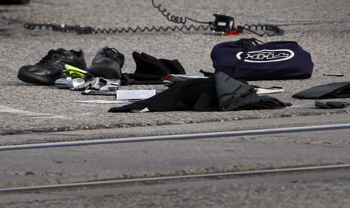 Rick Egan  | The Salt Lake Tribune 

Items from the motorcycle lie near the edge of the tracks, after a motorcycle collided with a TRAX train on 7700 South, Monday, March 11, 2013.