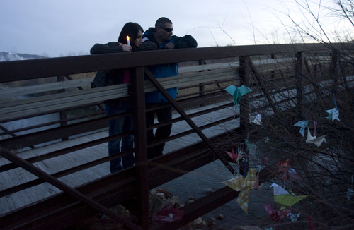 Kim Raff  |  The Salt Lake Tribune
Shawni and Scott Little look over the bridge where their niece, 15-year old Anne Kasprzak, was found dead one year earlier during a vigil on the Jordan River Parkway Trail in Draper on March 10, 2013. Kasprzak's parents are now saying they don't think police arrested the right men for killing her. They hope the vigil will eliciting new leads.