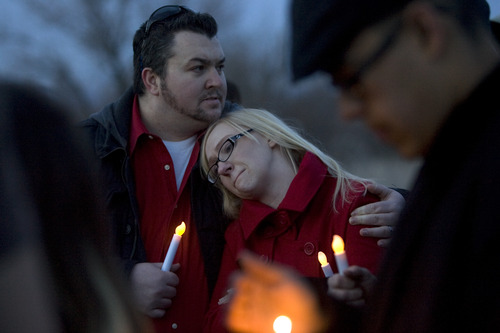 Kim Raff  |  The Salt Lake Tribune
Josh and Libby Slem attend a vigil for their 15-year old niece, Anne Kasprzak, at the bridge where she was found dead one year earlier on the Jordan River Parkway Trail in Draper on March 10, 2013. Kasprzak's parents are now saying they don't think police arrested the right men for killing her. They hope the vigil will eliciting new leads.