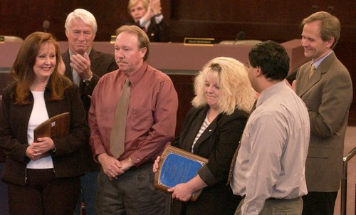 Leah Hogsten  |  The Salt Lake Tribune

The two couples who tipped police to the whereabouts of Elizabeth Smart and her kidnappers were recognized and honored before the Salt Lake City Council meeting on Tuesday. Elizabeth's father Ed Smart was also on hand to thank the couples for his daughter's return.l-r Anita and Alvin Dickerson and Nancy and Rudy Montoya are congratulated by the county council and Ed Smart (far right).