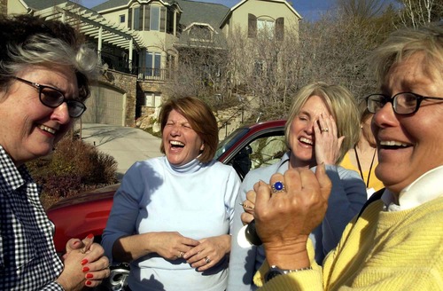 Trent Nelson  |  The Salt Lake Tribune

Neighbors of the Smart family, Charlotte Hamblin, Robyn Ingram, Sheri Rees and Becky Cannon celebrate outside the Smart home after Elizabeth was found alive on March 12, 2003.