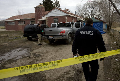 Kim Raff  |  The Salt Lake Tribune
Police investigate a shooting at a home at 2363 South Redwood Road in West Valley City on Monday, March 11, 2013.