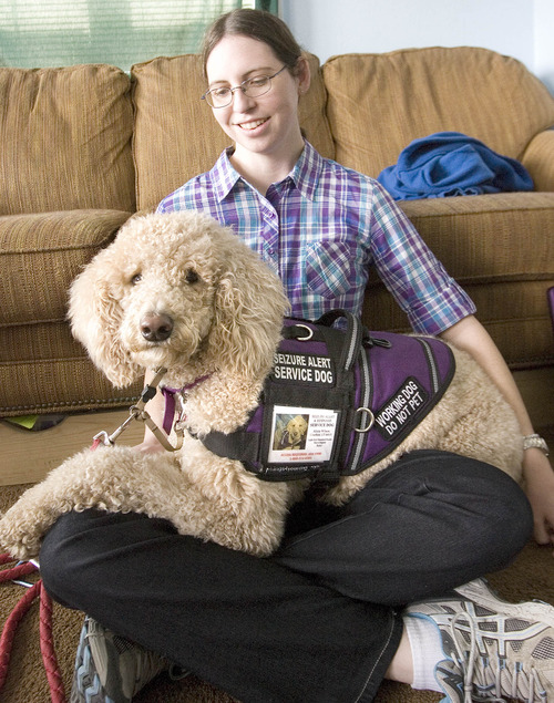 Paul Fraughton  |   Salt Lake Tribune
Alicia Wilson with her service dog "Ruby", a standard poodle.Ruby is wearing the vest identifying her as a service dog that she wore when Alicia was asked to leave her service dog outside a Little Caesars Pizza.
 Wednesday, March 13, 2013