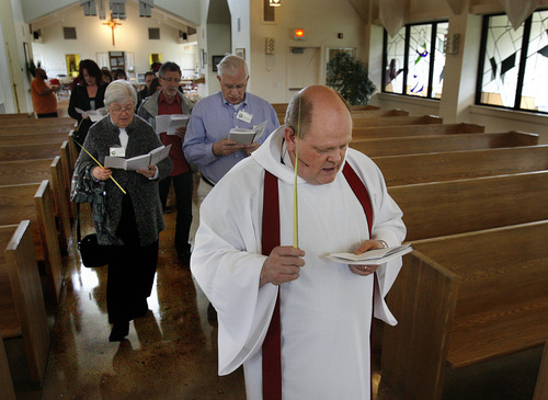 Scott Sommerdorf  |  The Salt Lake Tribune             
Rector Mike Mayor of All Saints Episcopal Church leads a procession as part of their Palm Sunday services, Sunday, April 1, 2012.