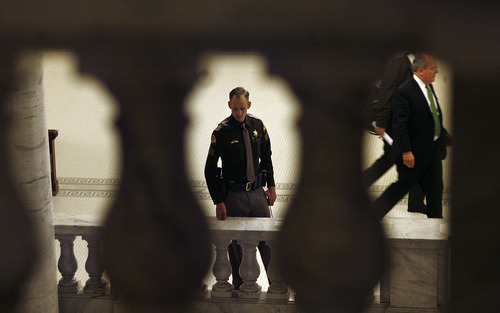 Scott Sommerdorf   |  The Salt Lake Tribune
A UHP trooper keeps an eye on things as the final day of the Utah Legislature heads into it's final hours just outside the Utah House of Representatives, Thursday, March 14, 2013.