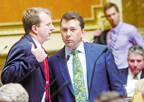 AL HARTMANN  |  The Salt Lake Tribune 
Rep. Stephen Sandstrom, R-Orem, right, takes time out during Friday's debate on his enforcement-only immigration bill to confer with Rep. Chris Herrod, R-Provo. The measure, after being amended for the second time in two weeks passed the House overwhelmingly, 58-15. It now goes to the Senate.