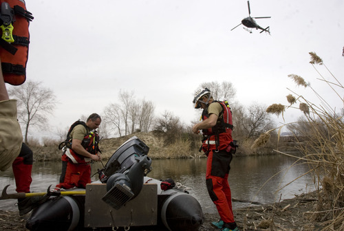 Kim Raff  |  The Salt Lake Tribune
Salt Lake County Search and Rescue gets ready to search the Jordan River as helicopters search for Benjamin Thomas Hyde in South Salt Lake on Friday. Hyde, who has mental and physical disabilities, has been missing since Wednesday evening.