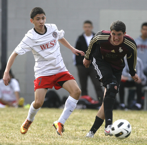 Rick Egan  | The Salt Lake Tribune 

Chris Sanxhez (7)West High goes for the ball, along with Tyler Allison (25), in prep soccer action Lone Peak vs. West, at West High, Monday, March 11, 2013.